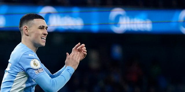 Manchester City's Phil Foden applauds during a Premier League soccer match between Manchester City and Tottenham Hotspur at the Etihad Stadium in Manchester, England, Saturday, February 19, 2022.