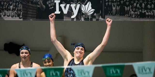 University of Pennsylvania swimmer Leah Thomas reacts after her team wins the 400-yard freestyle relay during the 2022 Ivy League Women's Swimming and Diving Championships at Blodgett Pool on February 19, 2022, in Cambridge, Massachusetts.