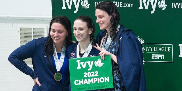 University of Pennsylvania swimmer Leah Thomas smiles on the podium after winning the 500th freestyle during the 2022 Ivy League Women's Swimming and Diving Championships at Blodgett Pool on February 17, 2022, in Cambridge, Massachusetts.