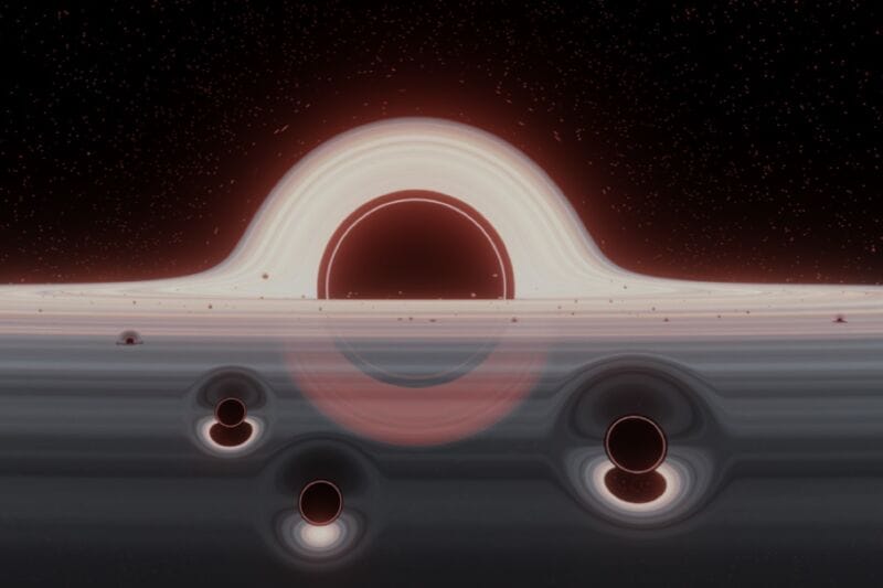 Illustration of a swarm of small black holes in a gas disk orbiting a supermassive black hole.