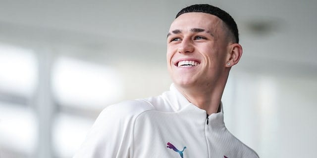 Manchester City's Phil Foden smiles during a recovery session after beating Sporting Lisbon in the UEFA Champions League on February 16, 2022 in Lisbon, Lisbon.
