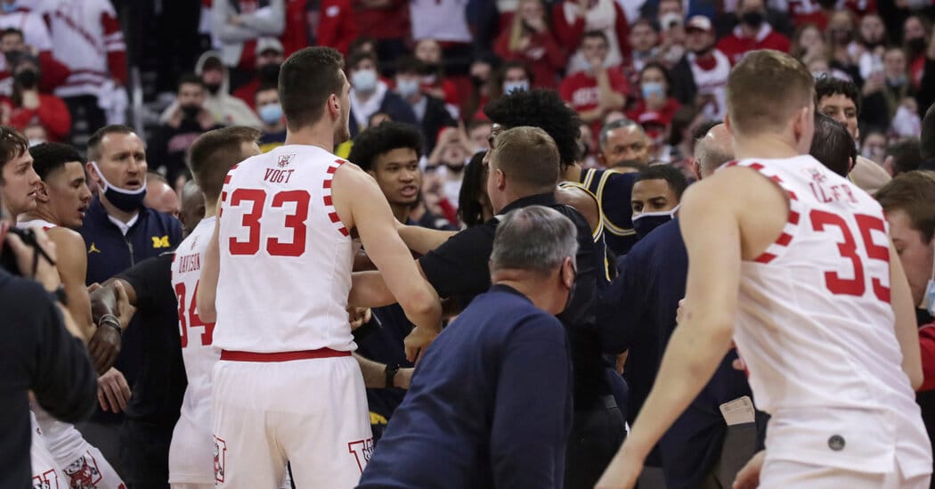 Joan Howard slaps his opponent coach after the Michigan Wisconsin game