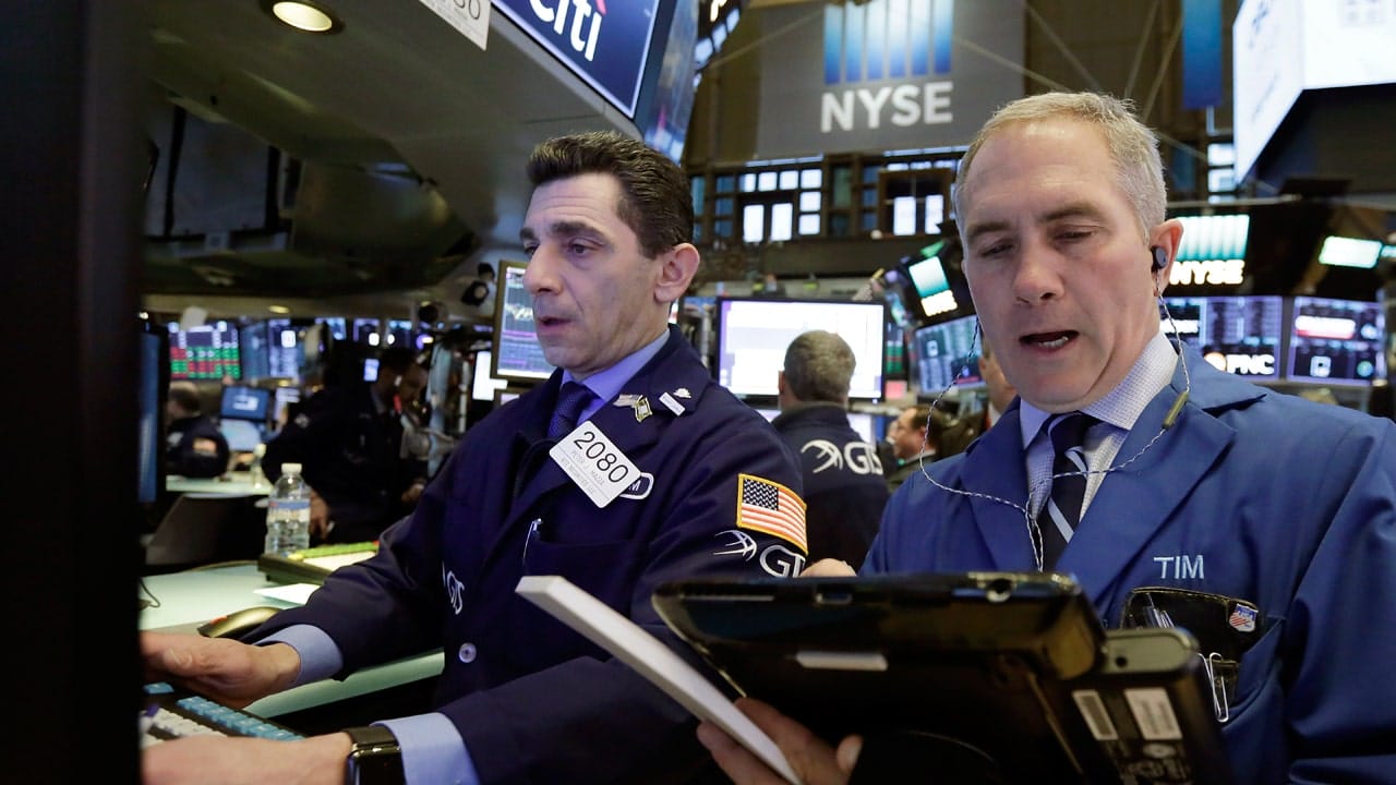 Stocks fall after Fed raises interest rates, oil nears $100